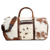 Make a statement at the gym with this cow skin gym bag, designed to keep you organized while exuding effortless style.