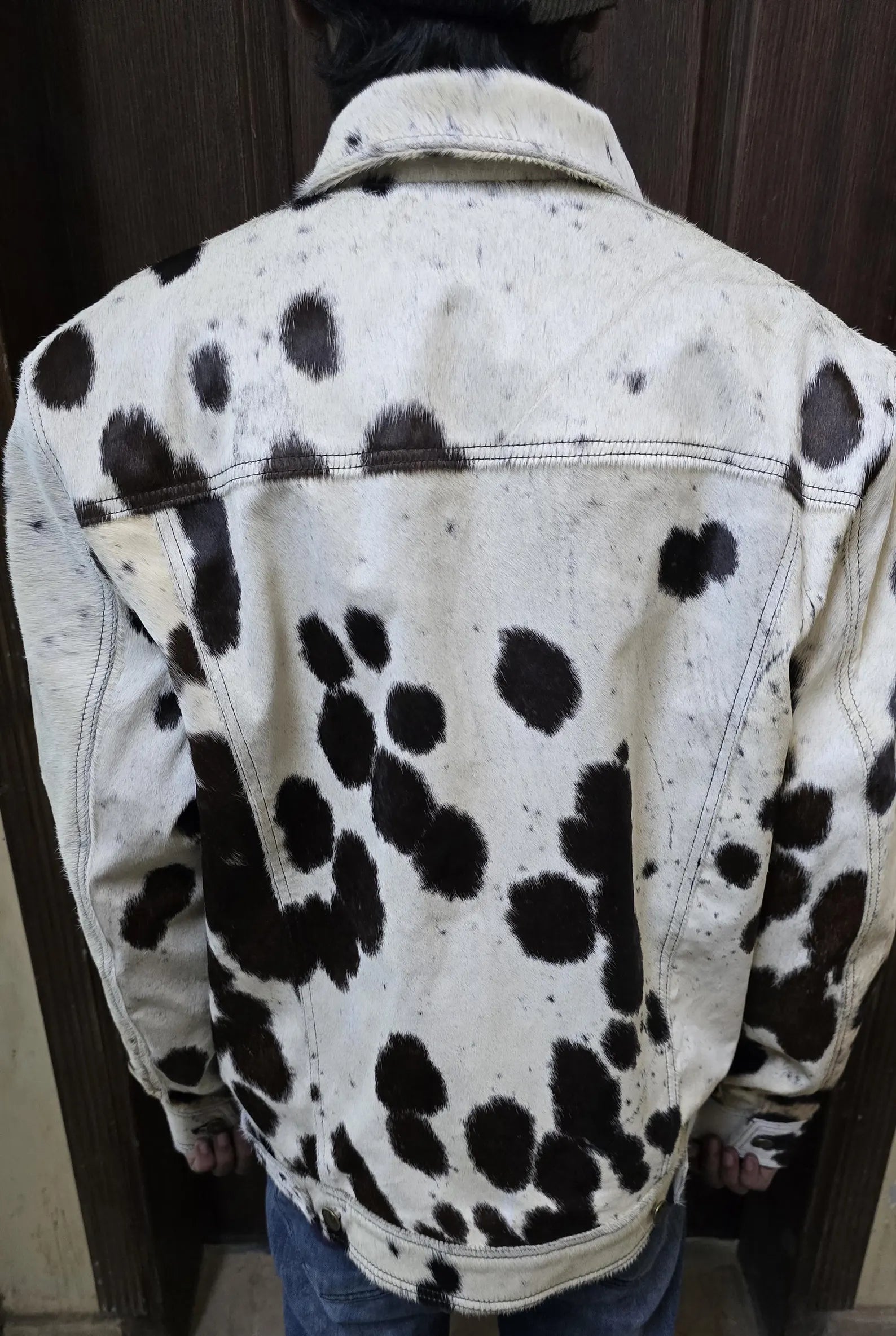 Men’s cowhide jacket with authentic cow print in natural fur. Unique cow fur coat blends cowboy edge with modern outerwear appeal.
