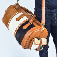 Discover new destinations with this cowhide travel bag, your passport to adventure.