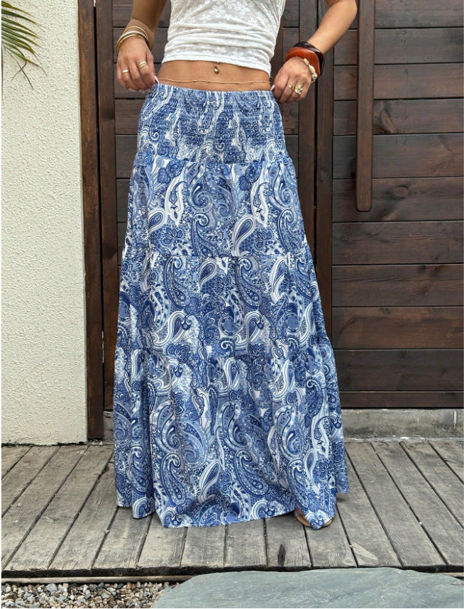 Smocked waist maxi skirt with tiered paisley print