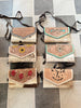 tooled leather hair on hide crossbody handbag