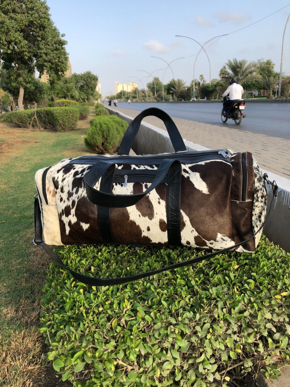 Elevate your travels with a sleek cow fur overnight bag, crafted for the discerning traveler's needs.