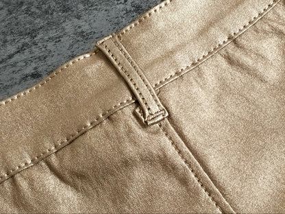 Gold shorts with low rise metallic faux leather fit
