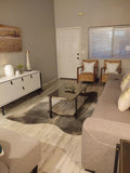 Discover the perfect accent piece for your home - a stunning, natural grey brindle cowhide rug. Make a statement with its rustic beauty.