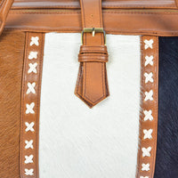 Experience the thrill of travel with this cow skin weekender bag, your essential companion.