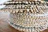 Natural seagrass placemats with cowrie shells