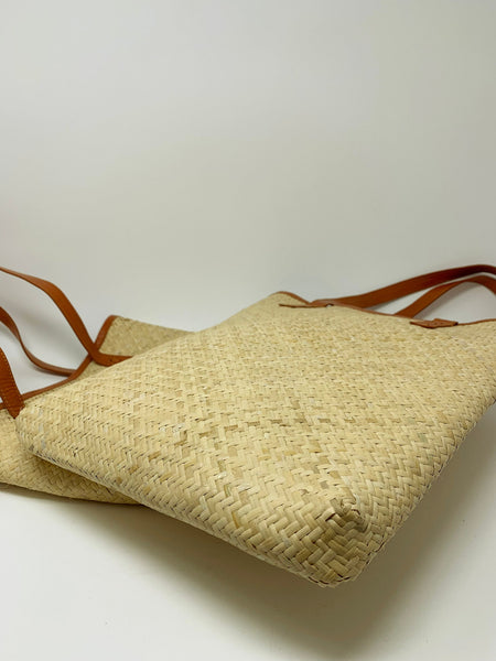 Handwoven rattan tote with leather straps