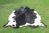 Bring the charm of nature indoors with a black and white cowhide rug. Its organic pattern adds an element of rustic beauty to your home.