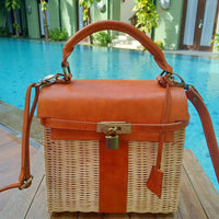 Handwoven rattan shoulder bag with leather