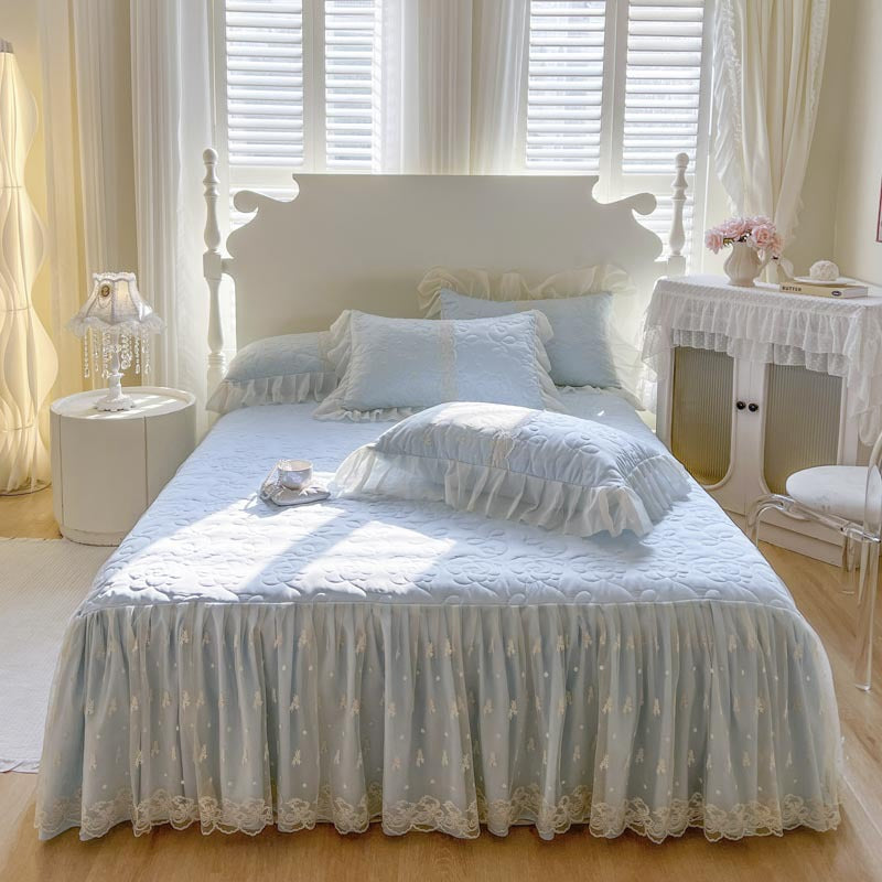 Quilted Bedspread with Lace Ruffled Bed Skirt and Floral Embroidery