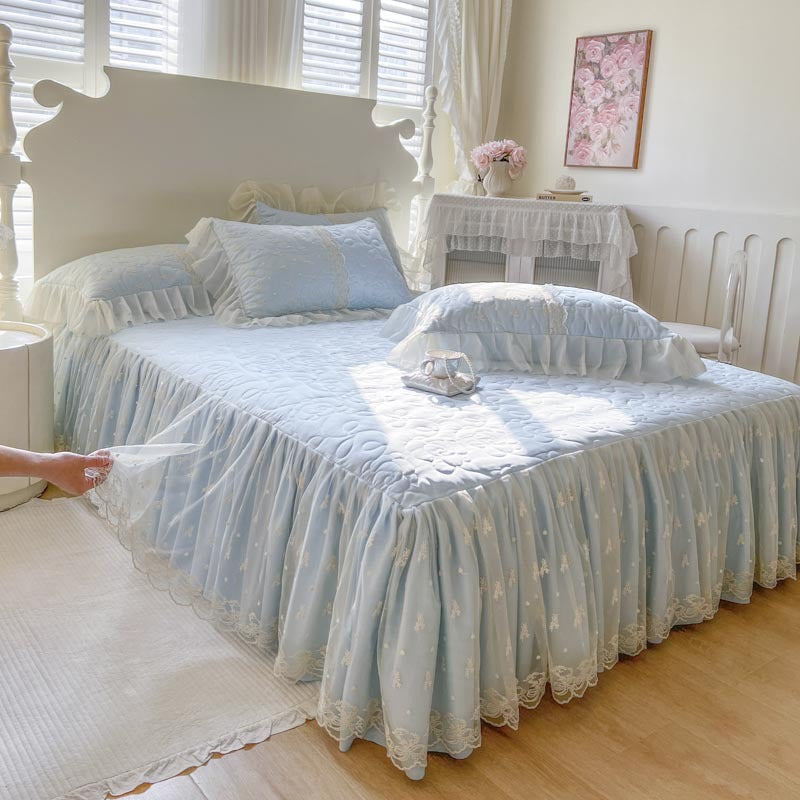 Quilted Bedspread with Lace Ruffled Bed Skirt and Floral Embroidery