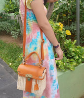 Handwoven rattan shoulder bag with leather