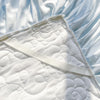 Quilted Bedspread with Lace Ruffled Bed Skirt and Floral Embroidery