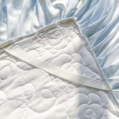 Quilted Bedspread with Lace Ruffled Bed Skirt and Floral Embroidery