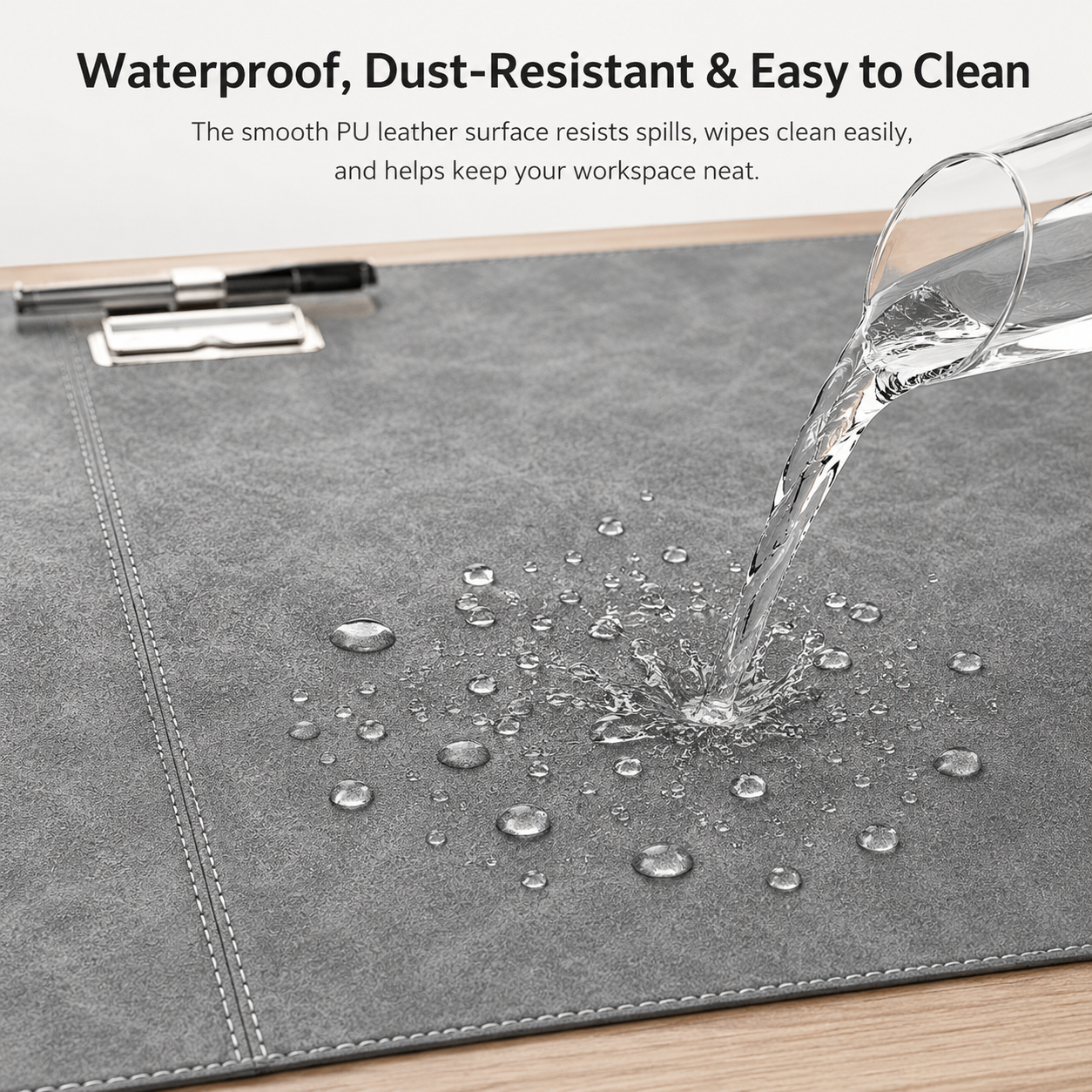 big desk pad with stitched edge detail and foldable device holder