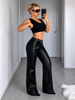 Black leather pants women look with straight leg shape and double belt accents