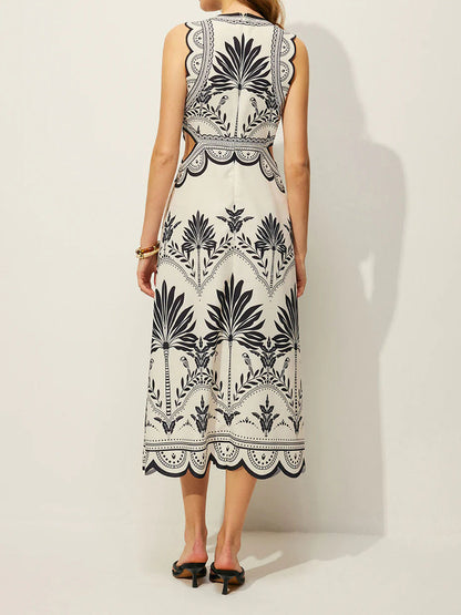 Black palm print midi dress with a fitted sleeveless bodice and open side-waist panels.