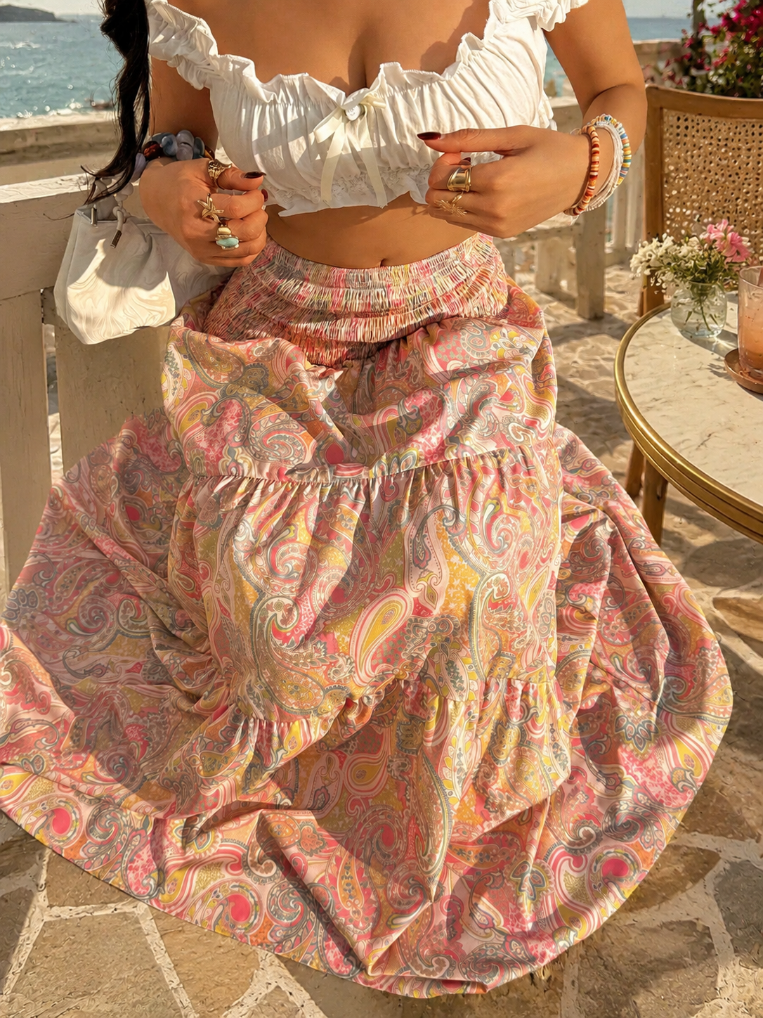 Smocked waist maxi skirt with tiered paisley print