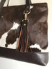 Brown white cowhide bag with fringe tassel