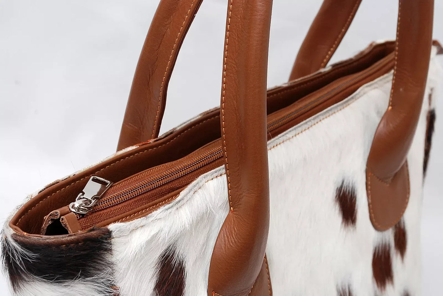 Brown and White Cowhide Tote Bag with Leather Handles