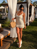 Cream crochet mini dress with scoop neck and ruffle hem
