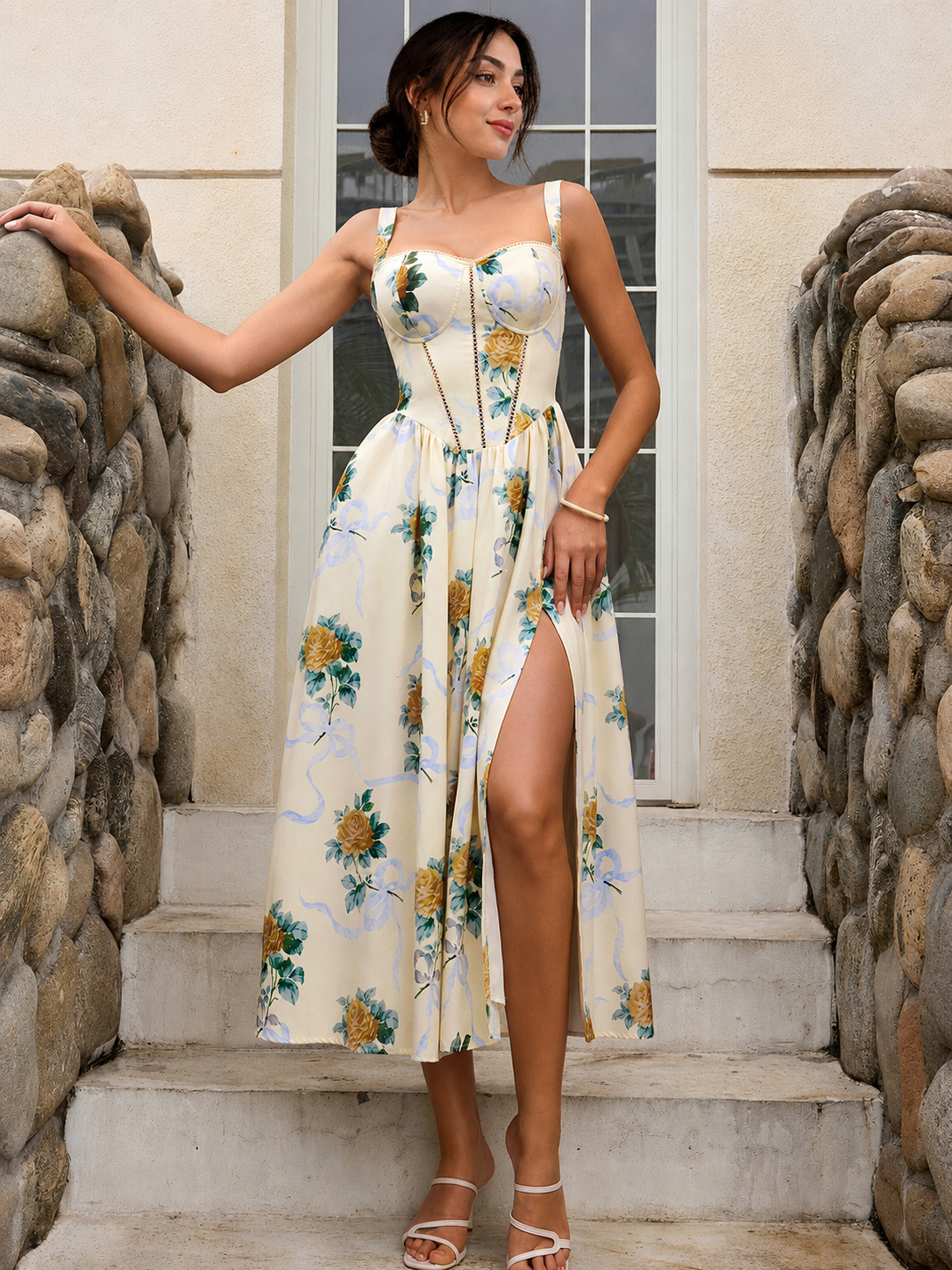 High slit dress with cream base, rose print, and flowing midi hem