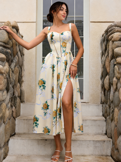 High slit dress with cream base, rose print, and flowing midi hem