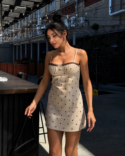 Cream polka dot corset mini dress with black lace trim