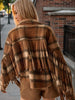 Cropped western fringe jacket featuring brown beige plaid fabric, button closure, pointed collar and flowing sleeve fringe.