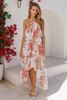 Flowy layered evening dress with lightweight fabric and multiple asymmetric tiers.
