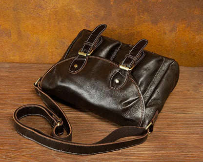 Full grain leather messenger bag with multiple exterior pockets for phone, wallet and frequently used daily essentials.