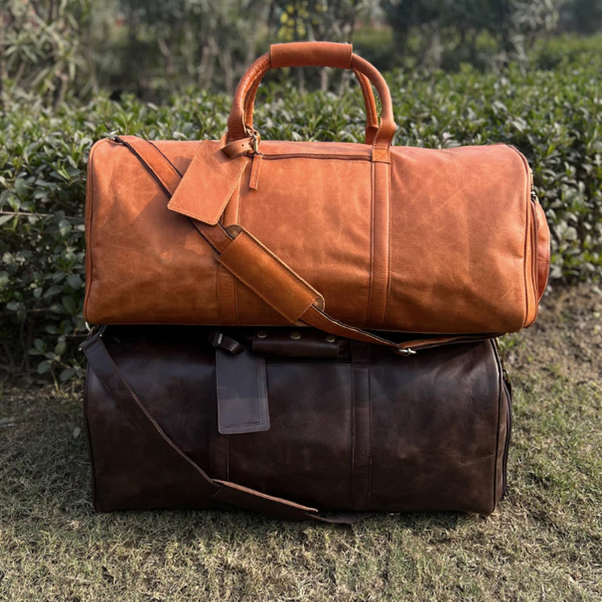 Full grain leather travel bag with separate footwear compartment, laptop section, interior zipper storage and durable brass fittings.