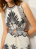 High-neck cutout vacation dress with an oval centre ring and flowing calf-length skirt.