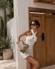 Cream crisscross halter dress with open back and keyhole