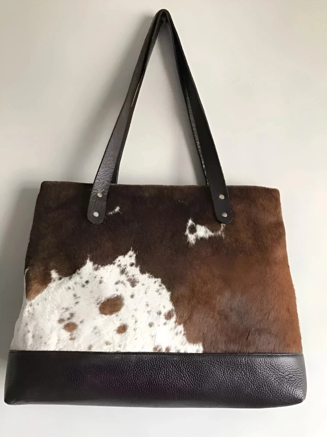 Brown white cowhide bag with fringe tassel