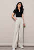 Linen wide leg pants with high waist, side pockets, and long straight fall