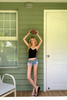 Low rise denim shorts with flag print and frayed hem