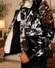 Men’s cowhide jacket with natural multitone hair-on hide, western styling, long sleeves, and distinctive textured character.