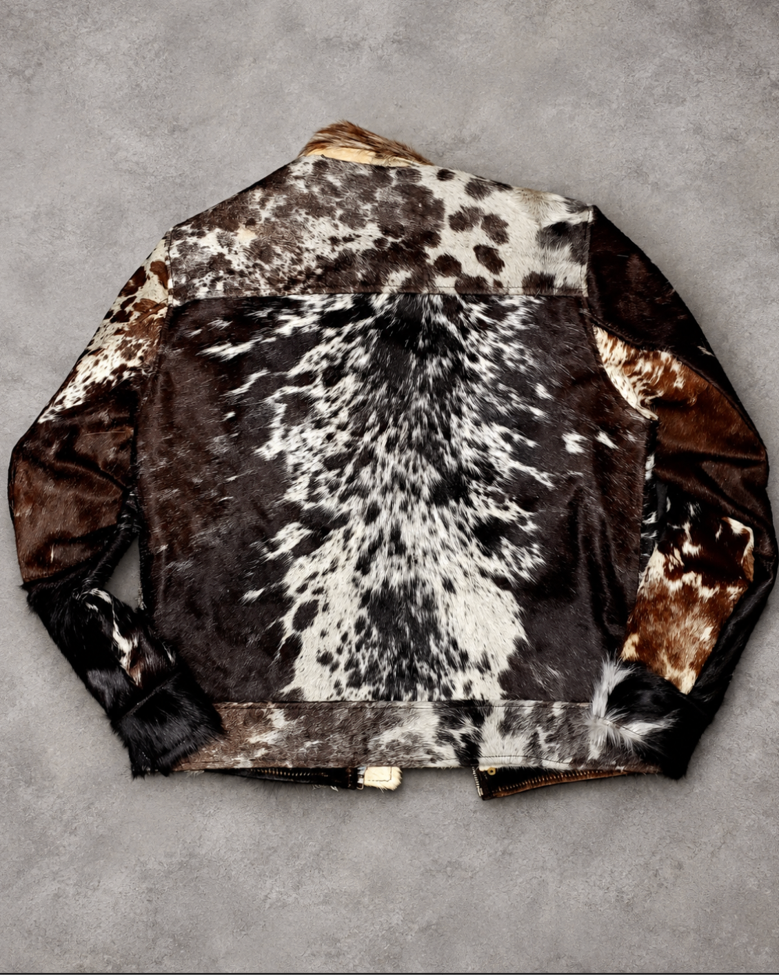 Men’s cowhide jacket with mixed natural hide markings.
