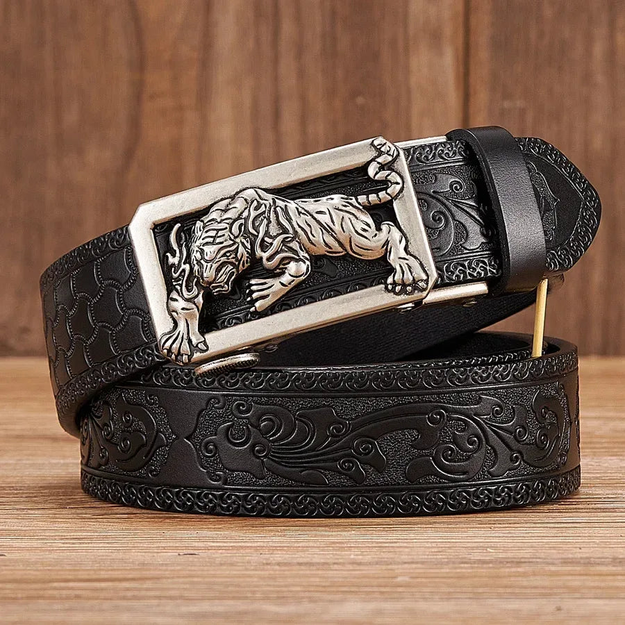 Men's embossed leather belt featuring a sculpted tiger buckle, dark leather strap, and decorative floral pattern.