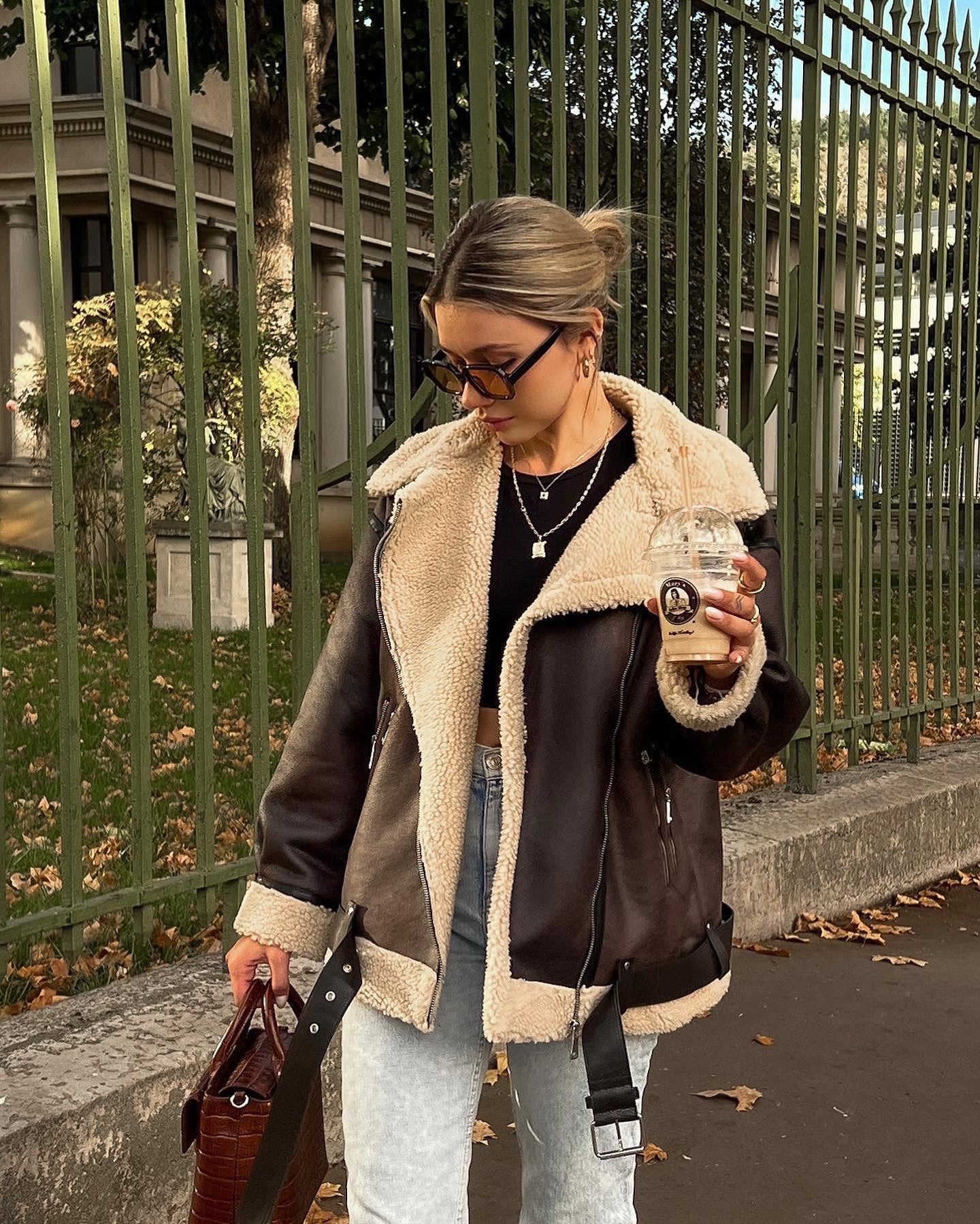 Brown shearling jacket with faux leather zip details