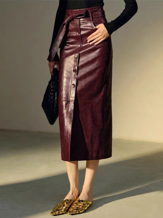 Women’s high waisted genuine leather skirt in maroon waxed sheepskin. Midi length with slit and belt detail for modern leather skirt outfits.