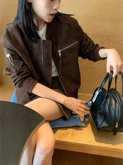 Women’s suede leather bomber jacket in premium goat suede. Cropped design with chest zipper pocket, perfect for autumn and winter streetwear styling.