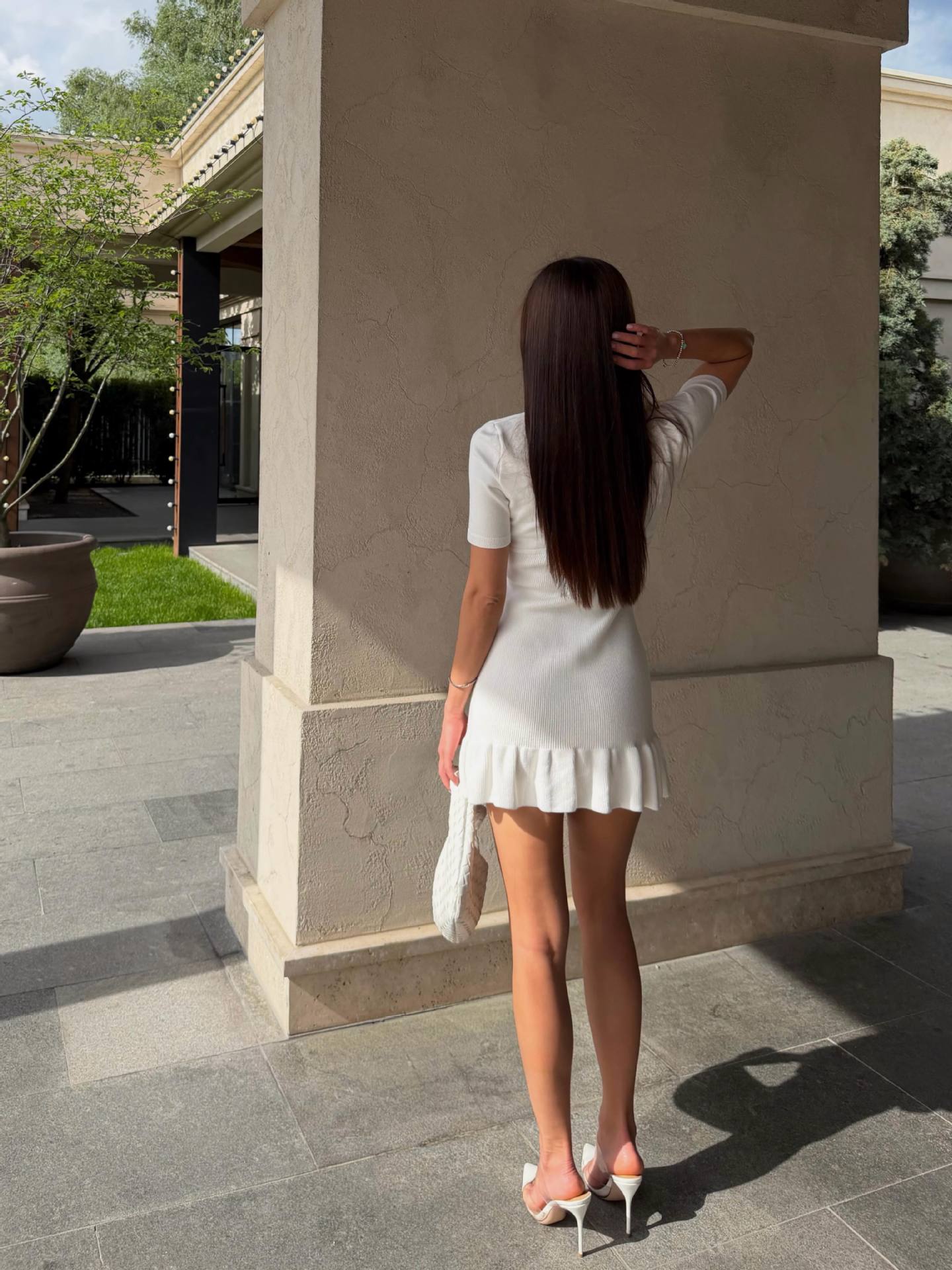 Cream knit mini dress with keyhole neck and ruffle hem