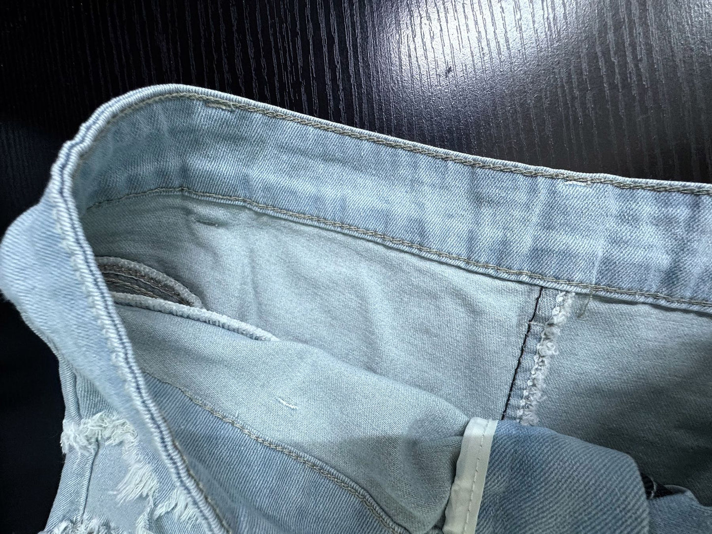 High waisted denim shorts with frayed light wash hem