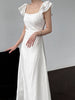 White flutter sleeve linen maxi dress with open back waist fit