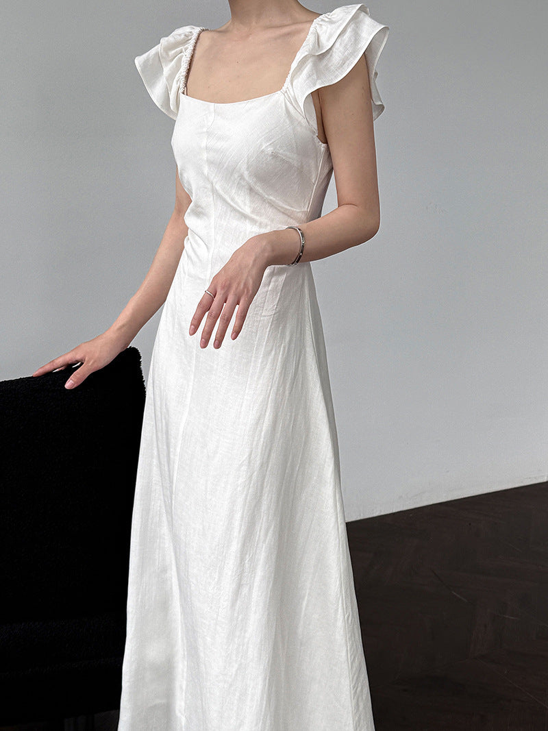 White flutter sleeve linen maxi dress with open back waist fit