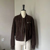 Premium goat suede leather bomber jacket for women. Cropped motorcycle design with secure zipper pockets, made for autumn layering and winter wear.