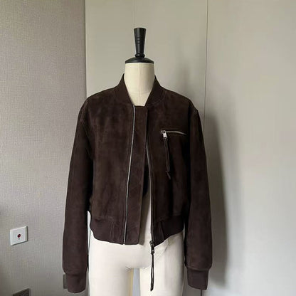 Premium goat suede leather bomber jacket for women. Cropped motorcycle design with secure zipper pockets, made for autumn layering and winter wear.