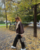 Brown shearling jacket with faux leather zip details